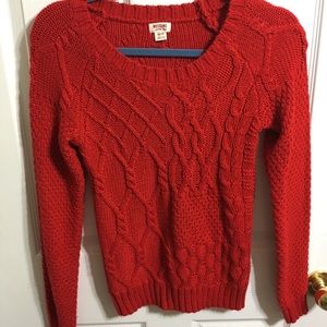 Red cable knit sweater